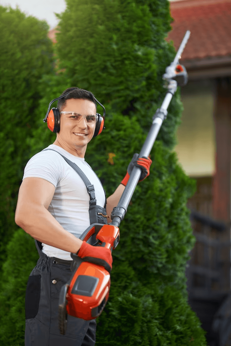 A man holding a blower